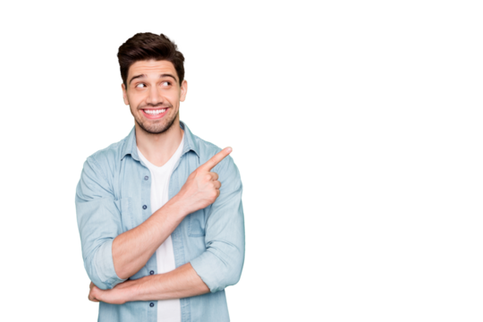 Photo of amazing salesman guy in excited mood indicating finger to empty space advising cool shopping prices wear casual denim shirt isolated green color background