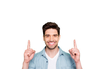 Photo of amazing guy indicating fingers up to empty space advising cool low shopping prices wear...