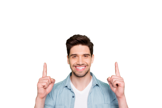 Photo of amazing guy indicating fingers up to empty space advising cool low shopping prices wear casual denim shirt isolated green color background