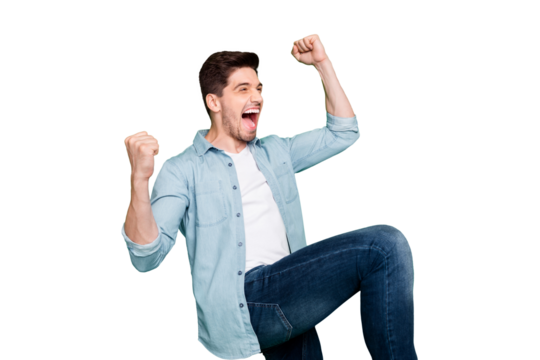 Profile photo of amazing crazy guy yelling loudly celebrating favorite football team victory raise fists and leg wear denim shirt isolated green color background