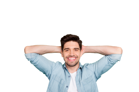 Photo of cheerful handsome attractive man holding his head with hands having relax after difficult work day isolated over green vivid color background