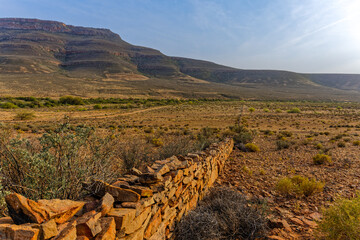 Old stone wall in barren valley