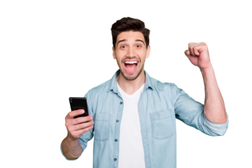 Photo of casual brunette haired crazy ecstatic overjoyed man rejoicing when having known of being accepted to job holding phone shouting victoriously isolated over green vivid color background