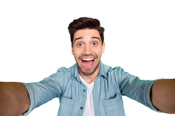 Self portrait of cheerful positive handsome man taking selfie having holidays on vacation relax fun...