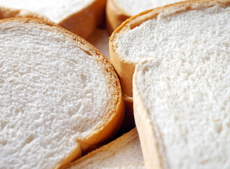 Close-up of freshly sliced ​​soft and fragrant bread with white bread,brown bread crust macro