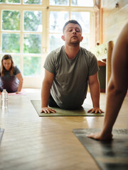 Stretching, yoga and meditation with group, man and exercise with fitness, wellness and stress relief. People, workout and breathing with performance, activity and hobby with energy, relax or healthy