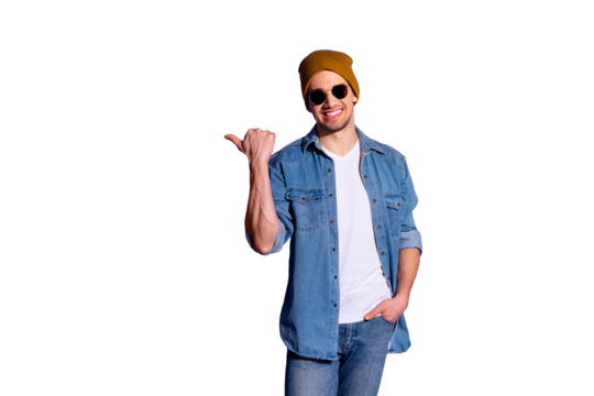 Photo of good cheerful attractive handsome freelancer holding hand in denim pocket cap smiling toothily pointing at empty space isolated over vivid purple color background