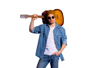Photo of confident attractive handsome man wearing brown cap spectacles standing with guitar on his shoulder and hand in pocket isolated over purple vibrant color background