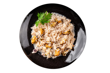 Rice seafood risotto mussels, shrimp, prawn, rapan, squid vegetable dish fresh gourmet food background on the table rustic food top view copy space