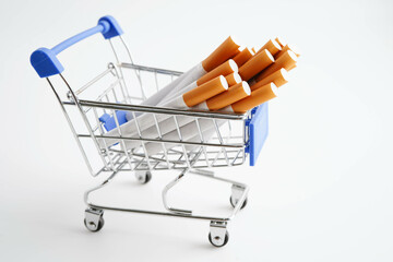Cigarette in shopping cart, cost, trading, marketing and production, No smoking concept.