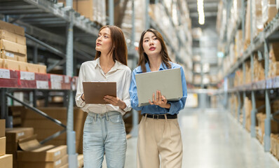Female engineers team discussing inventory in warehouse logistics and supply chain planning, operation management, data analysis, warehouse shipping, inventory tracking, optimization and technology
