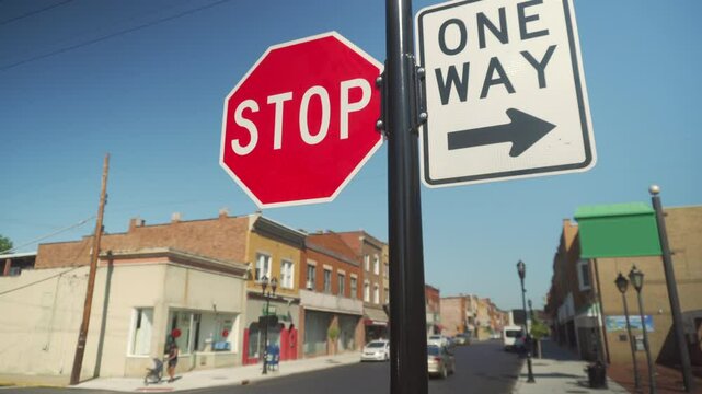 A daytime dolly-up establishing shot of a typical small town street corner in middle America. Pittsburgh suburbs.  	