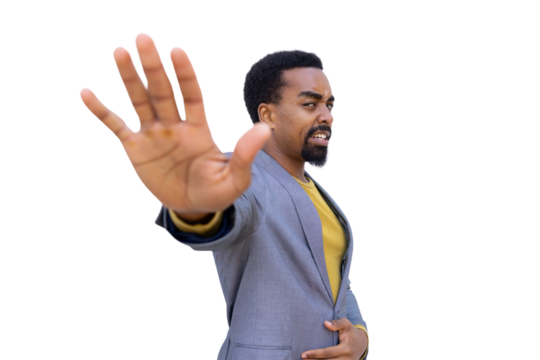 Serious businessman showing stop gesture with hand on transparent background