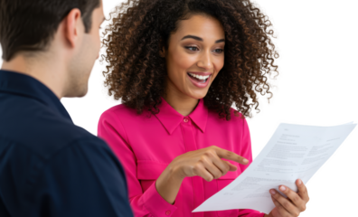 Animated woman in pink blouse pointing at document with focused man