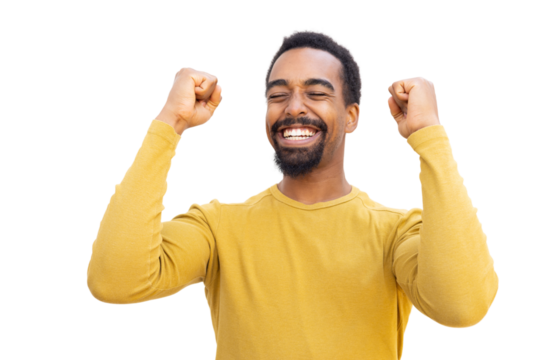 Bearded man in yellow sweater celebrating, triumphantly raising fists against transparent background