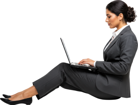 Businesswoman Focused on Laptop Sitting Down Working on Project