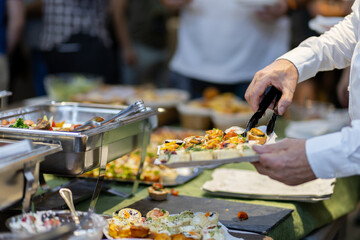 Buffet served at a festive gathering featuring a variety of appetizers during an evening event