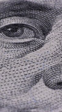 100 US dollar banknote Extreme macro. Fragment of one hundred dollar bill close-up. Detail view of USD currency cash. Vertical footage