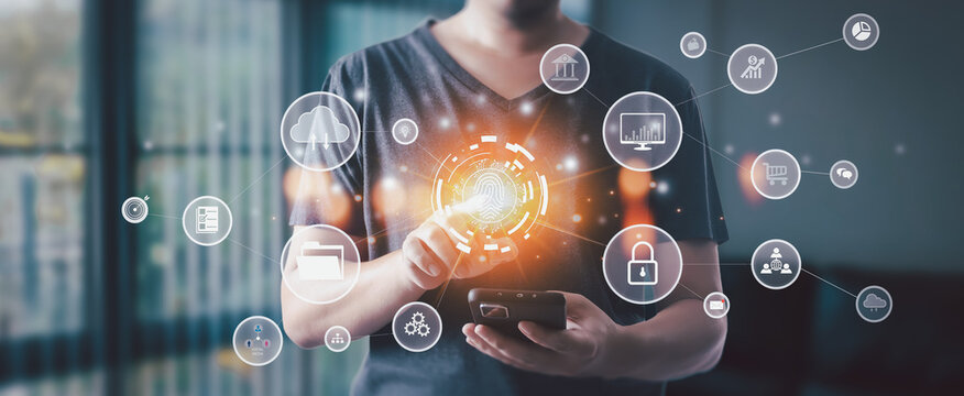 Businessman scans fingerprint on smartphone, surrounded by digital icons of holograms, smart networks, data transfer, and internet systems, symbolizing data archiving and automation.