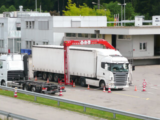 A truck is going through up the x ray check at a national border