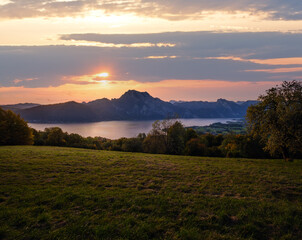Peaceful autumn Alps mountain lake. Sunrise view to Traunsee lake, Gmundnerberg, Altmunster am Traunsee, Upper Austria.