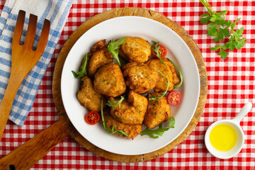 Cod fritters, a traditional Spanish tapa. Top view table.