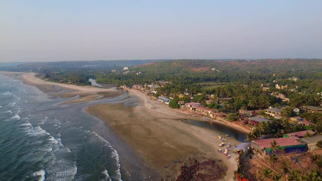 Aerial View of Tropical Village, River and Wide Sandy Beach by Ocean