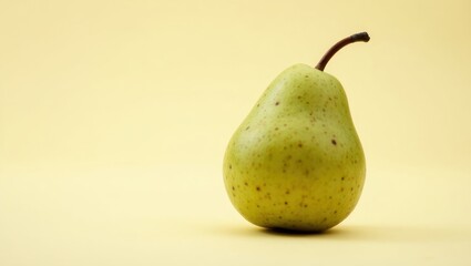 A Singular Green Anjou Pear: A Study in Minimalist Elegance and Natural Beauty on a Pale Yellow Canvas.
