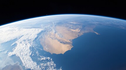 Earth viewed from space, vibrant blue oceans, green landmasses, dramatic clouds, theme of global perspective and exploration.