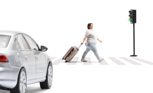 Woman pulling a suitcase at a zerba crossing