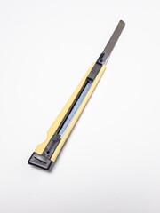 Close up of a utility knife on a white background for cutting