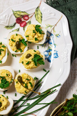 Eggs stuffed with mousse of egg yolk, mayonnaise, mustard and capers.