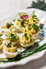 Eggs stuffed with mousse of egg yolk, mayonnaise, mustard and capers.