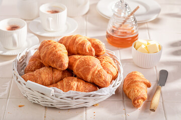 Homemade and fresh french croissants served with coffee.