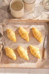 Delicious french croissants preparation before baking in oven.