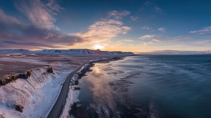 Fototapeta premium Icelandic coast road glistens under sunset