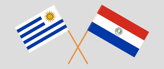 Crossed flags of Uruguay and Republic of Paraguay. Official colors. Correct proportion. Vector illustration