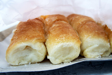 Three sweet breads covered with sugar with the appearance of melted sugar
