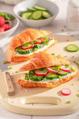 Golden and healthy french croissant as a sandwich for vegans.