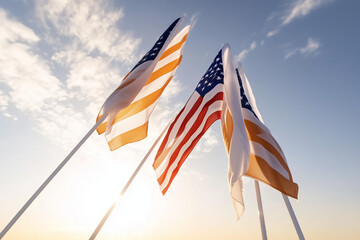 American Flags Waving In Sunlight With Blue Sky And White Clouds Symbolic Of Patriotism And Freedom
