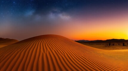 Obraz premium Serene desert landscape at sunset with rippling sand dunes under a starry sky