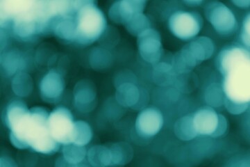 Teal toned bokeh effect for dreamlike abstract backgrounds or wallpapers