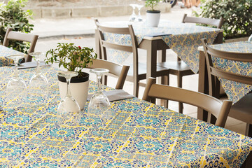 Outdoor restaurant tables setting in Sicily, Italy