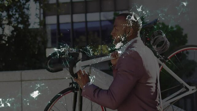 Business professional walking carrying bicycle past office building, showing crackle light effects - Powered by Adobe