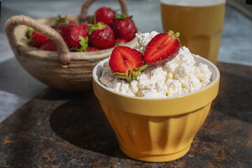 Fresh strawberry curd cheese, served in a yellow bowl along with a bowl of fresh strawberries. Healthy Breakfast