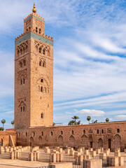 Koutoubia Mosque and minaret in Marrakesh, Morocco, featuring Almohad architecture and ancient ruins under blue sky, showcasing Islamic cultural heritage, religious significance and authentic history.