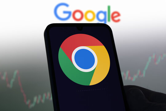 Chrome Google on a screen, in the blurred background the logo of Google.