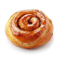Fototapeta premium Shiny golden cinnamon swirl roll glazed with sugar coating on a white surface 