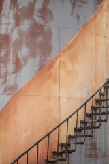 Artistic image of rusted staircase on old fuel tank at Port Nolloth harbour, South Africa