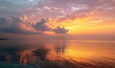 Fototapeta premium Golden sunrise over calm water